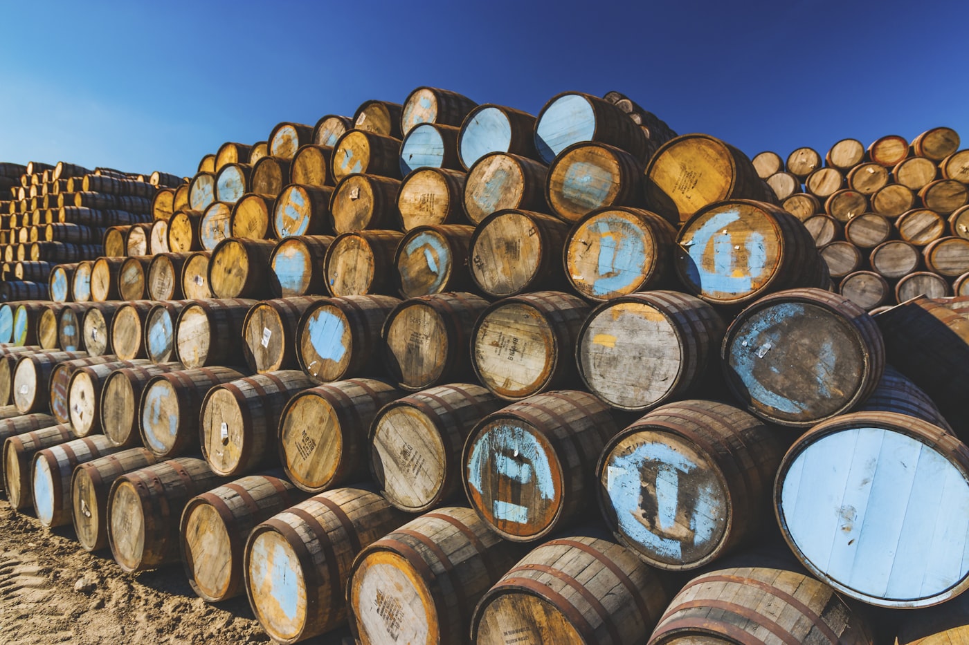 Scotch whisky casks stacked at a Scottish cooperage